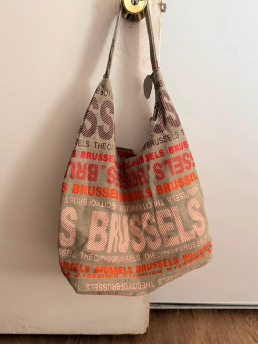 Robin Ruth Beige Canvas Hobo with Orange and Brown Text